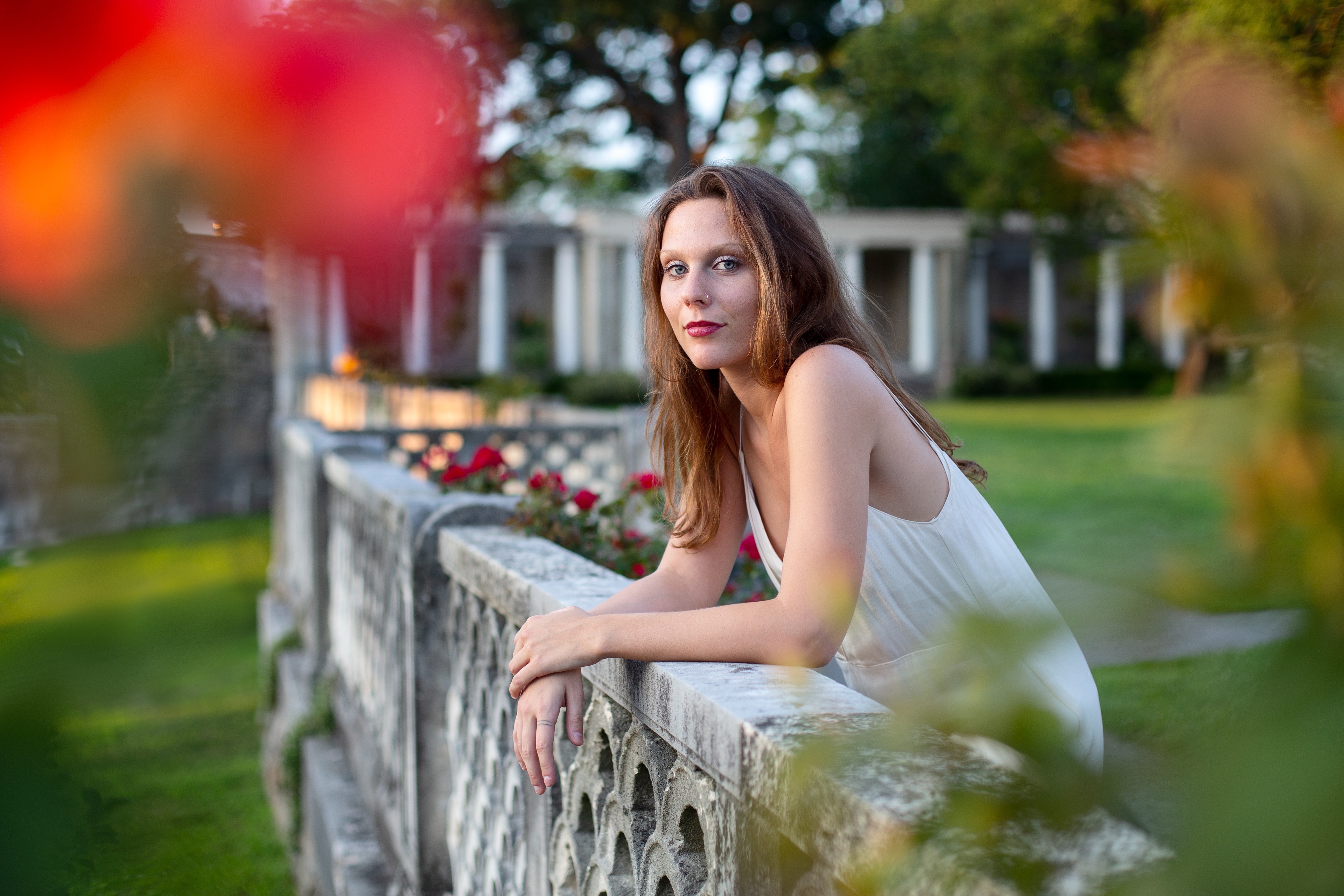Model posing on balcony with natural light