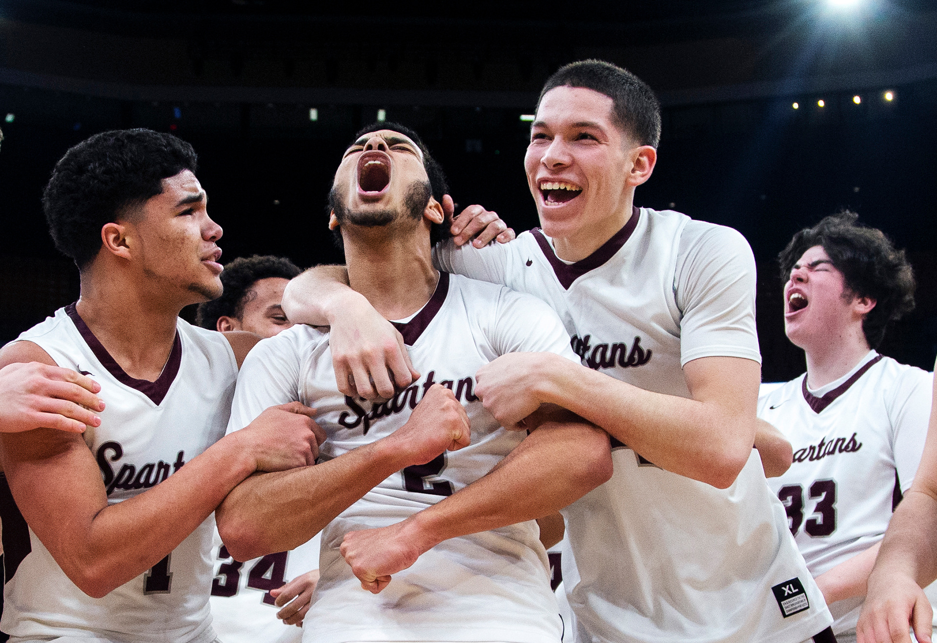 Basketball team huddle during college game