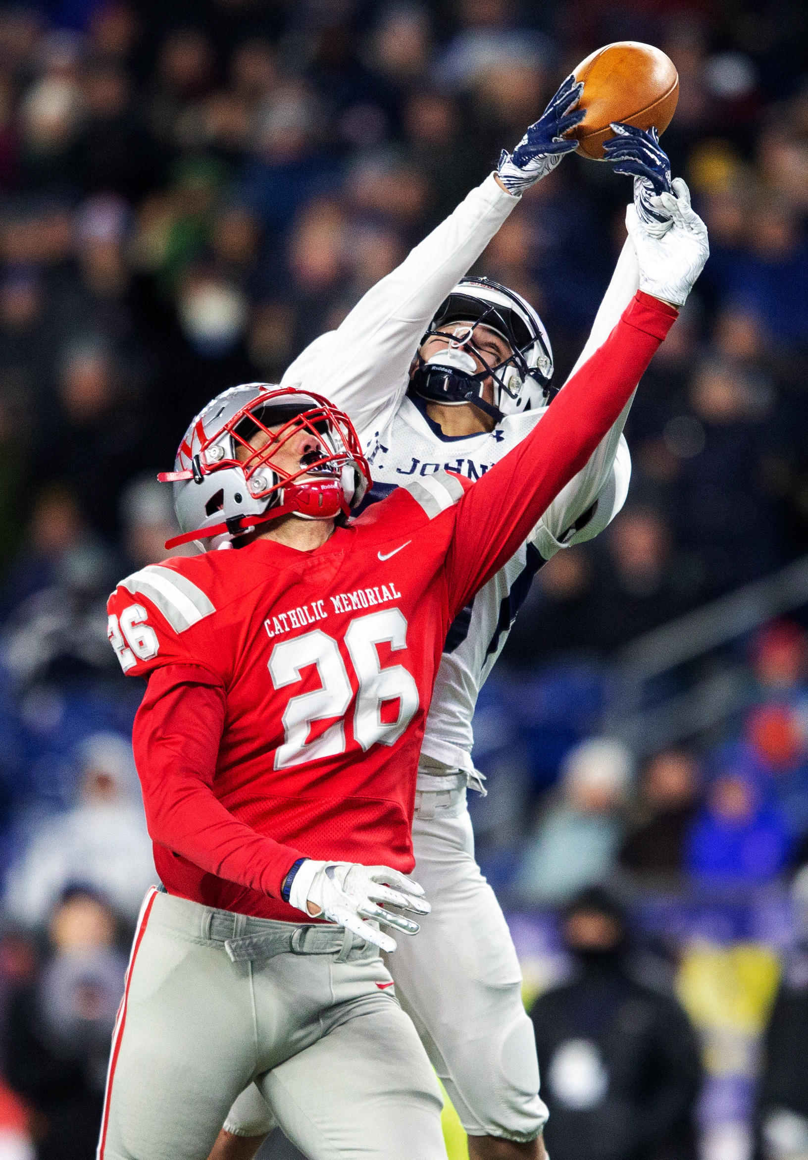 Football player making a catch during game