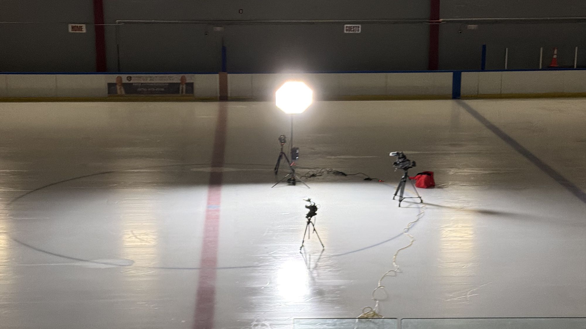 One octa, two cameras, and a lav kit set up at center ice in an empty rink