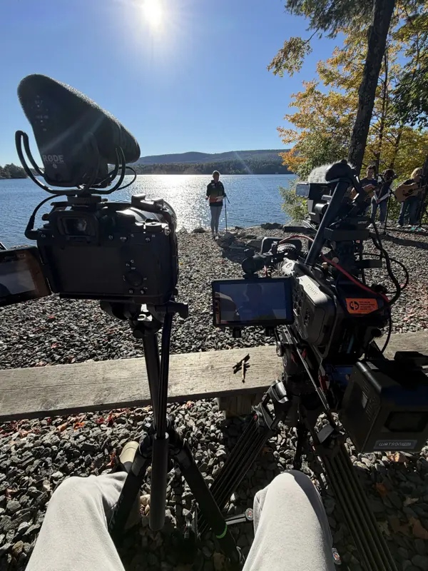 Cameras set on the shore of the lake at Camp Mah-Kee-Nac on Saturday afternoon