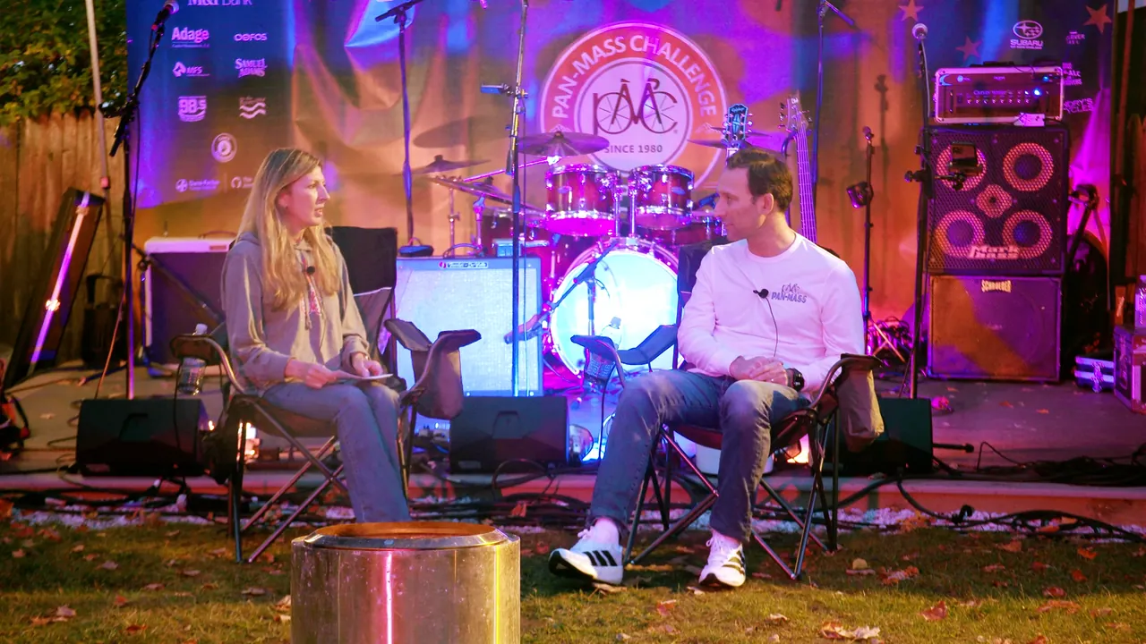 Dr. Ben Ebert and host Meredith Beaton-Starr on the PMC stage by the lake at Camp Mah-Kee-Nac